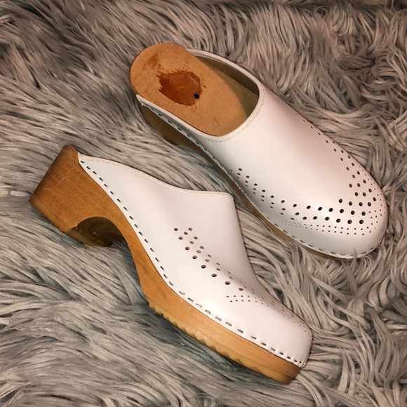 white wooden clogs